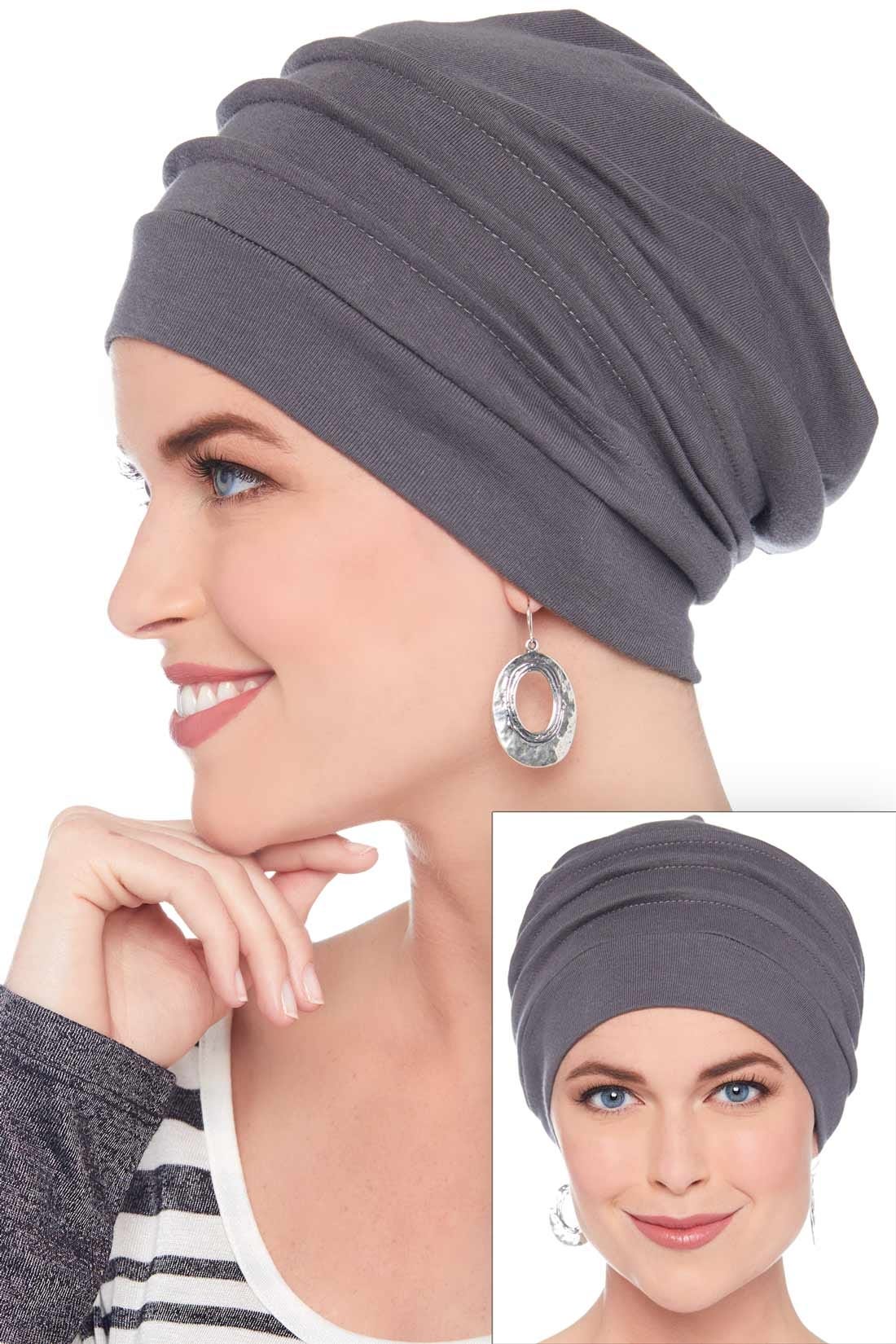 Women wearing grey slouchy beanie hat for cancer patients with pleats and loose fit