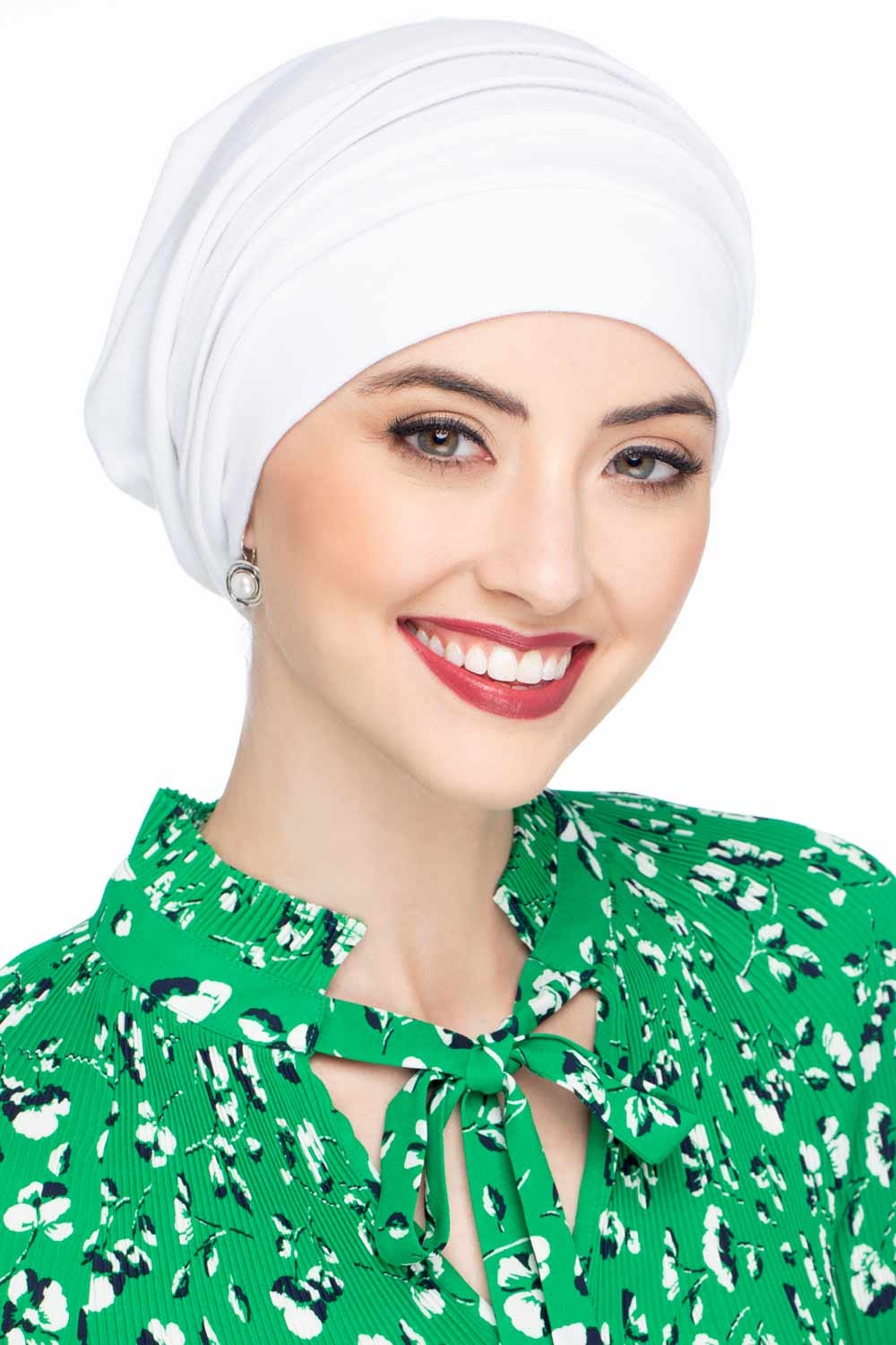 Lady wearing white chemo hat with slouchy fit