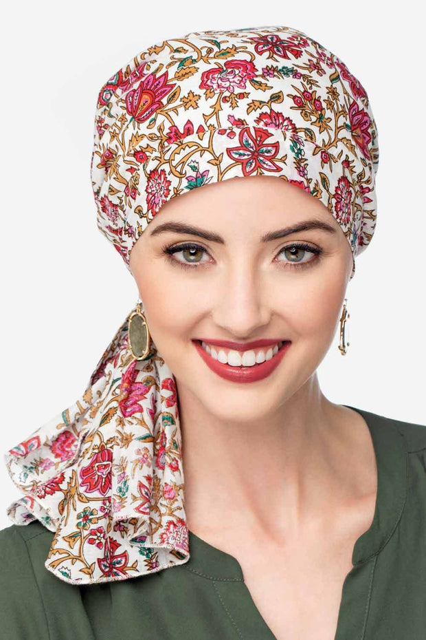 Woman in black paisley pre tied head scarf headcovering for cancer patients
